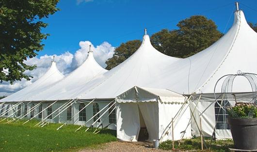 high-quality portable restrooms stationed at a wedding, meeting the needs of guests throughout the outdoor reception in Bloomdale